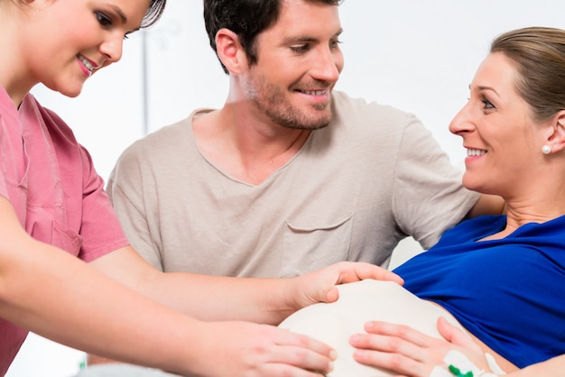 Pregnant woman and her man in delivery room