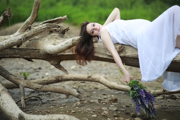 Pregnant woman in nature for a walk in the summer