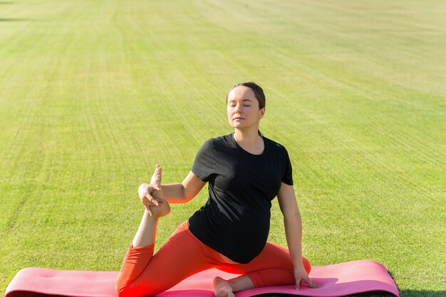 pregnant woman performs various yoga asanas