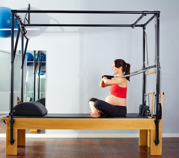 pregnant woman pilates reformer arms exercise