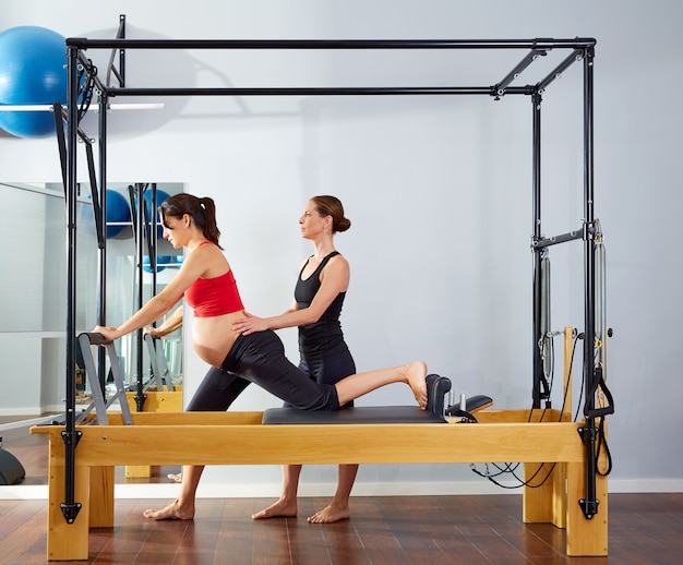 pregnant woman pilates reformer cadillac exercise