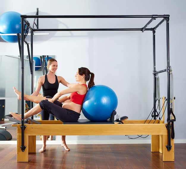 pregnant woman pilates reformer fitball exercise