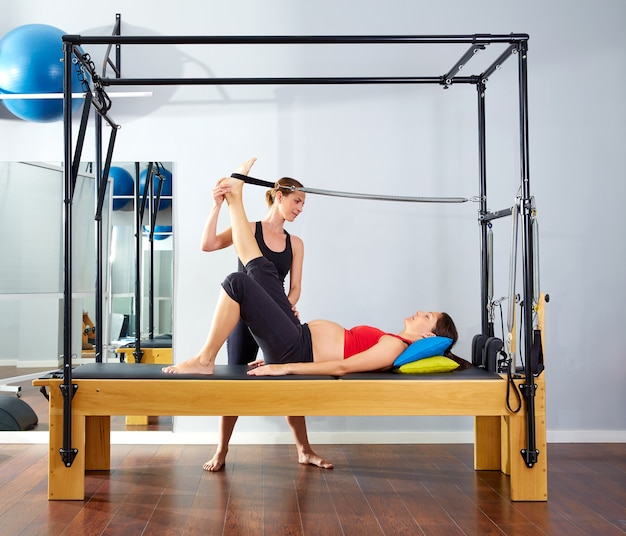 pregnant woman pilates reformer leg spring