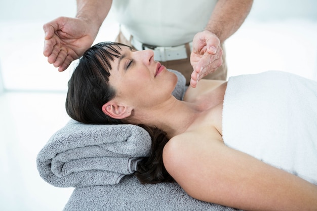 Pregnant woman receiving a massage from masseur at the health spa