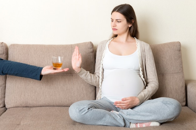 Pregnant woman  refuses to drink whisky