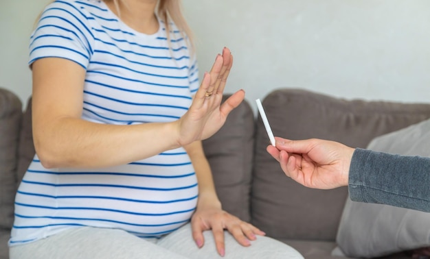 The pregnant woman refuses to smoke Selective focus