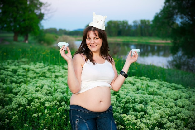 Pregnant woman relaxing on nature