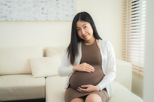 Pregnant woman sitting near the window at hospital