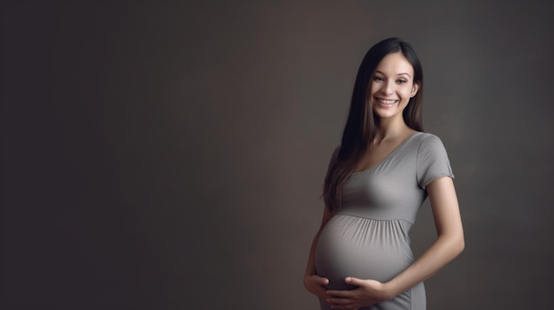 A pregnant woman smiles as she stands in front of