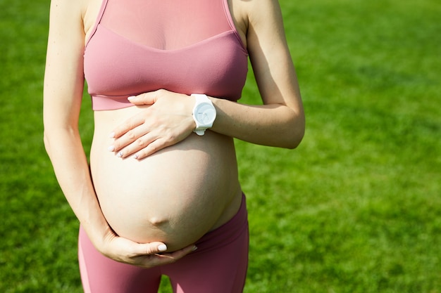 Pregnant woman standing outdoors