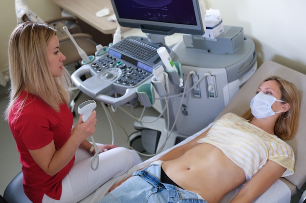 Pregnant woman on ultrasound examination at hospital ultrasound diagnostics in clinical