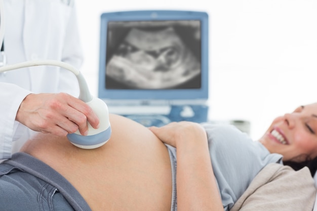 Pregnant woman undergoing ultrasound