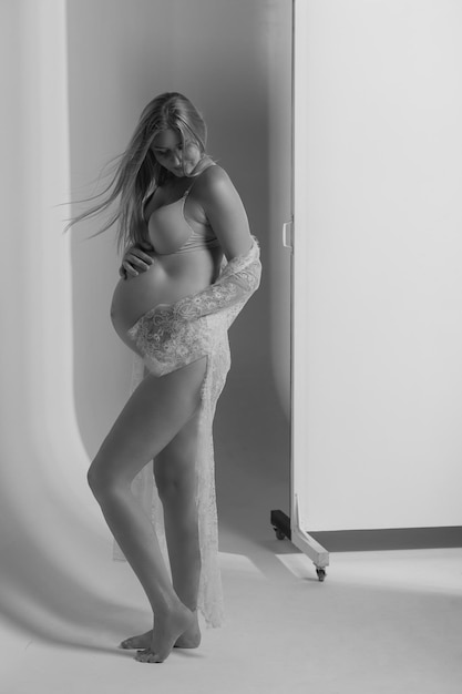 Pregnant woman in underwear. Studio shot