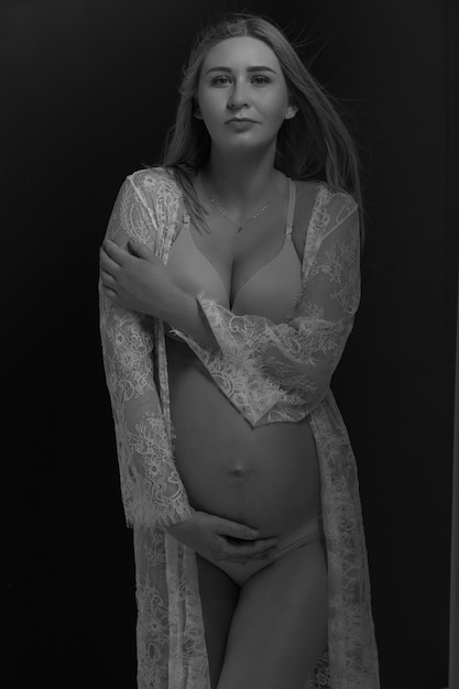 Pregnant woman in underwear. Studio shot