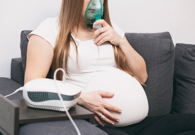 Pregnant woman use inhale mask at home