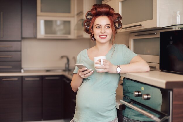 Pregnant woman using a smartphone