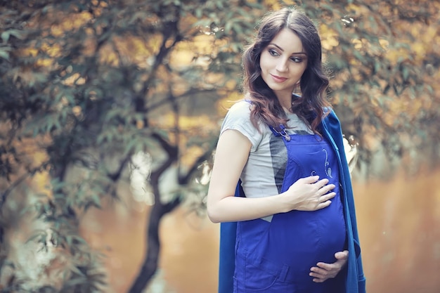 Pregnant woman on a walk in the park