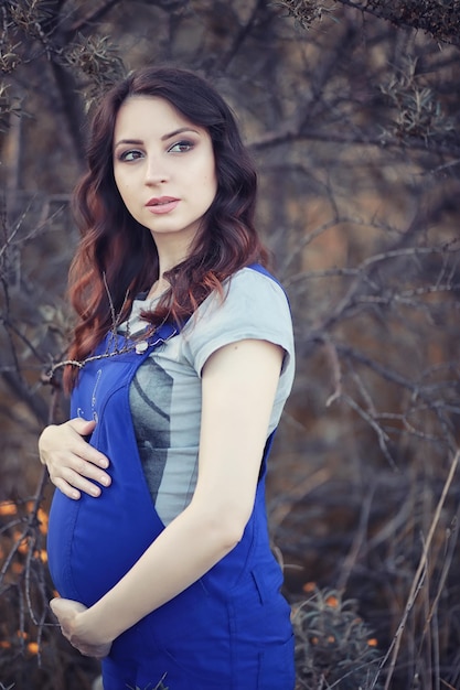 Pregnant woman on a walk in the park