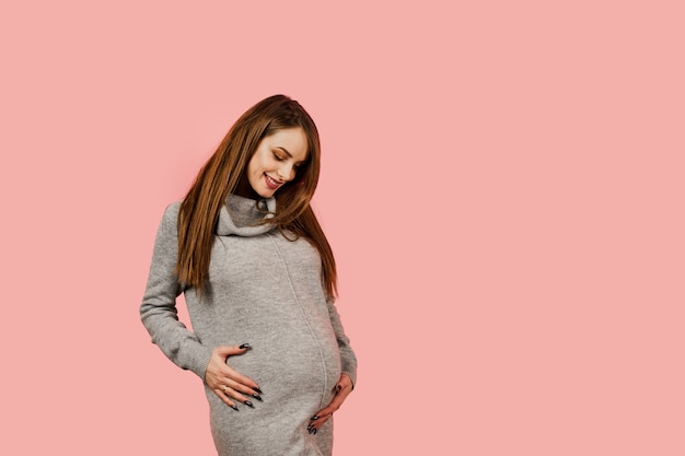 Pregnant woman wearing comfortable clothes expecting child