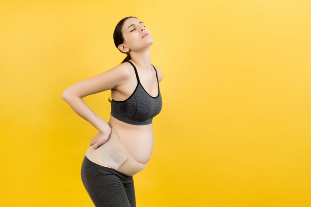 pregnant woman wearing elastic pregnancy bandage