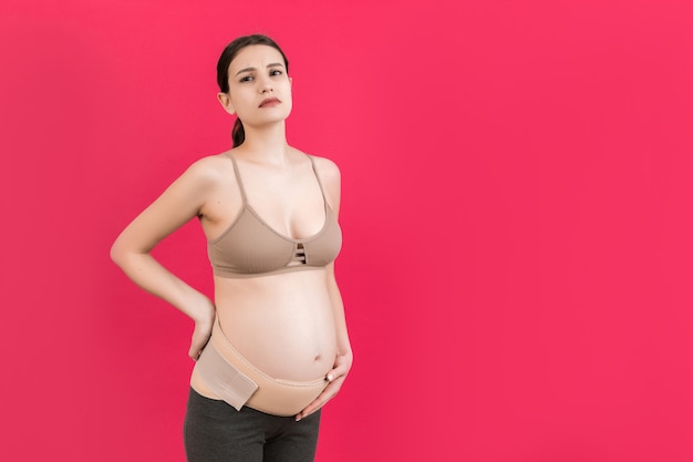 pregnant woman wearing elastic pregnancy bandage