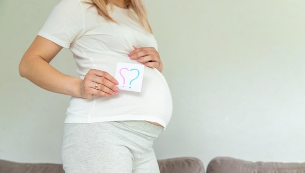 Pregnant woman who will be the question mark Selective focus