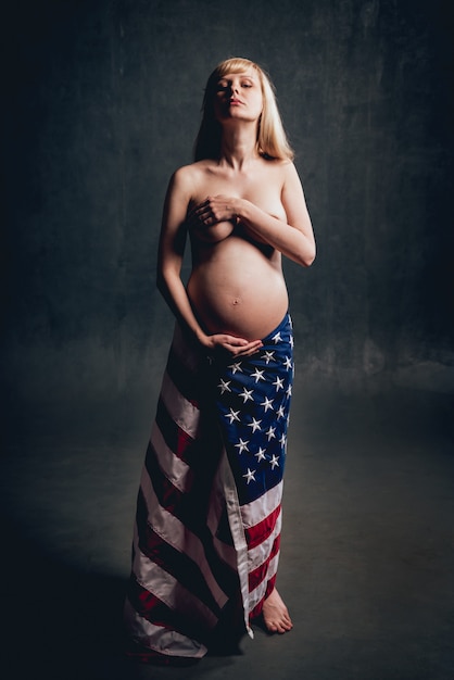 Pregnant woman with american flag.