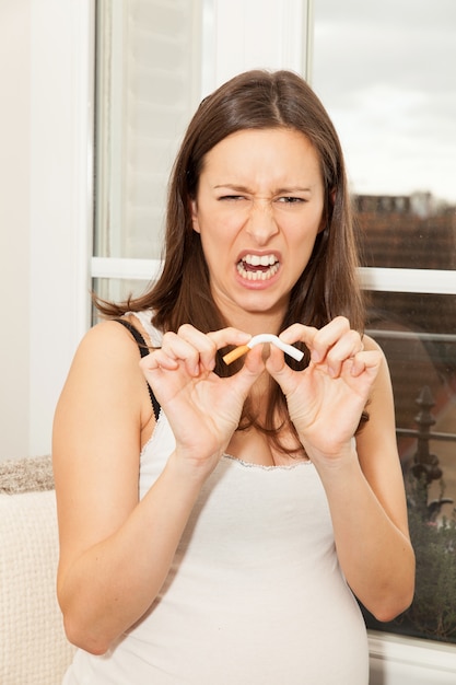 Pregnant woman with a cigarette