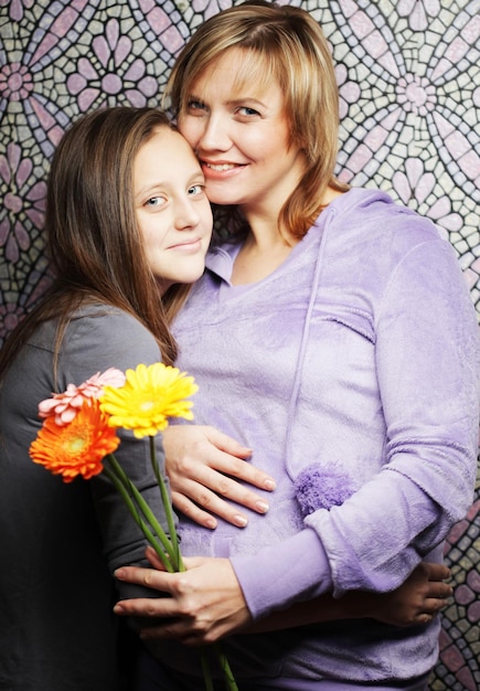 Pregnant woman with daughter