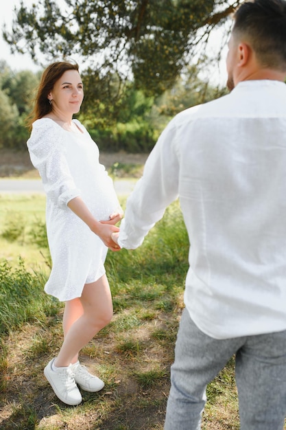 Pregnant woman with her family looking happy