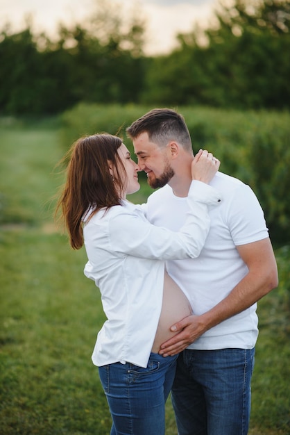 Pregnant woman with her family looking happy