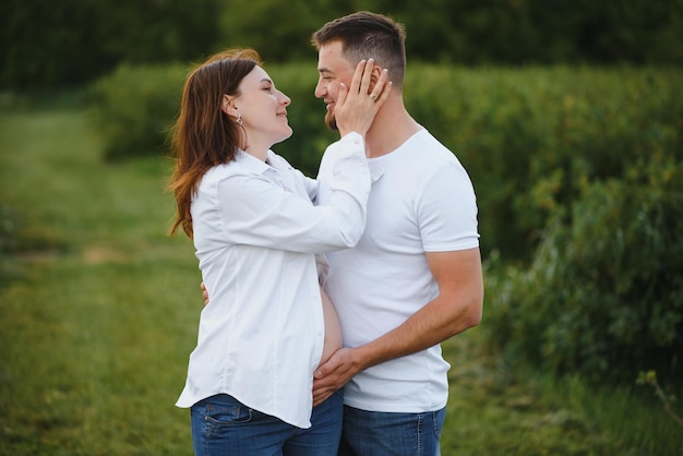 Pregnant woman with her family looking happy