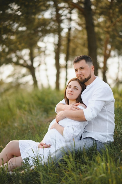 Pregnant woman with her family looking happy