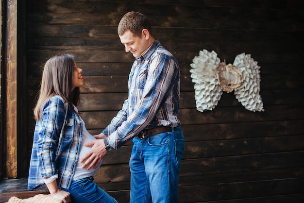 Pregnant woman with her husband waiting for newborn