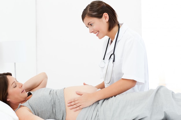 Pregnant woman with a nurse