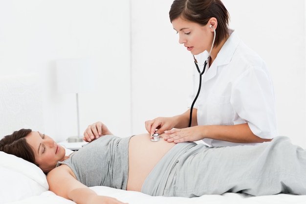 Pregnant woman with a nurse