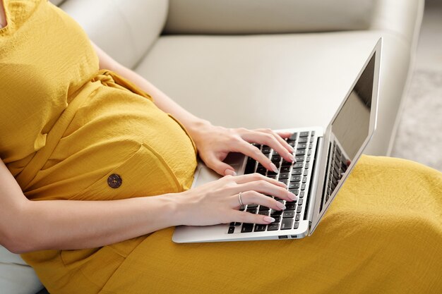 Pregnant woman working from home