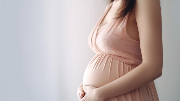 Pregnant women holding their belly on white background