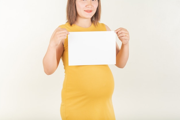 Photo pregnant women and small paper labels.