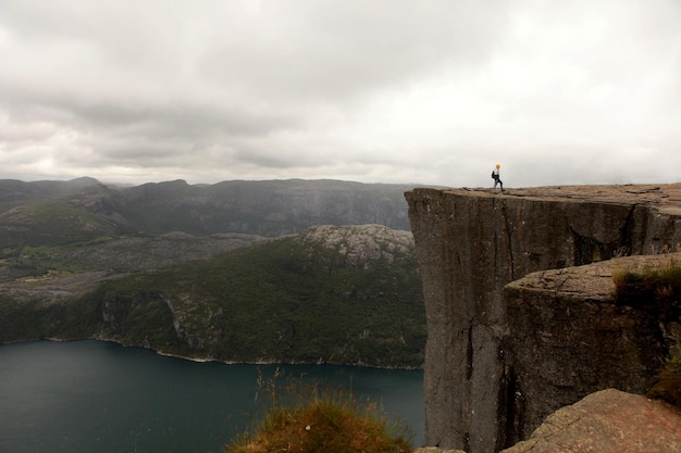 Preikestolen the Pulpit Rock, most famous tourist attraction in Ryfylke, towers an impressive 604 metres over the Lysefjord. Cliff in Norway - nature and travel