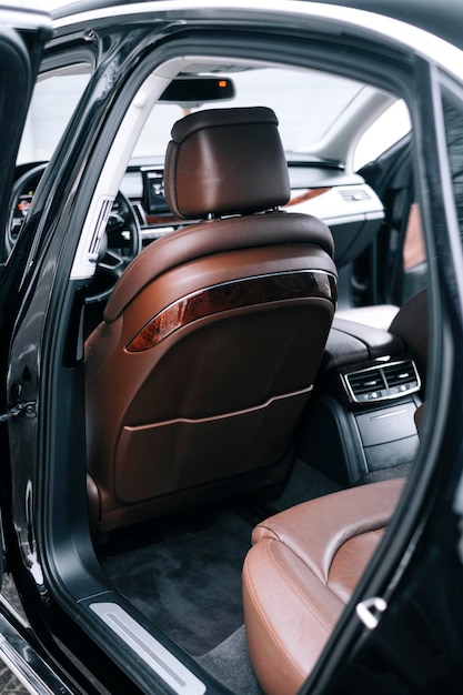 Photo premium car interior, brown perforated leather, decorative inserts the  interior, leather steering.