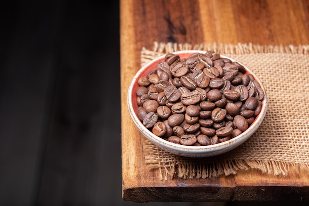 Premium Colombian Coffee Beans on Wooden Plank