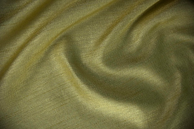 A premium silk background glod abstract cloth wavy texture design use as wallpaper table sheet