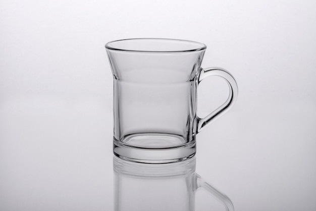 Preparation of aromatic morning coffee. Empty white coffee cup on a table