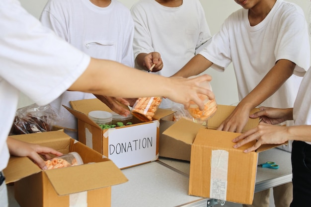 Photo preparation for charity event humanitarian activist packing food for donation