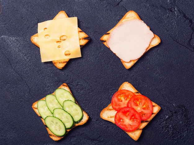 Preparation clubsandwiches on a stone chopping board