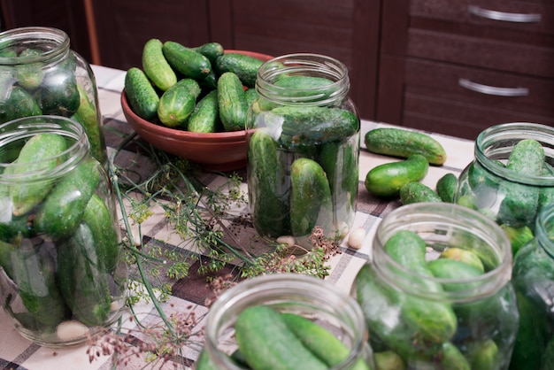 Preparation of cucumbers for home canning pickles.