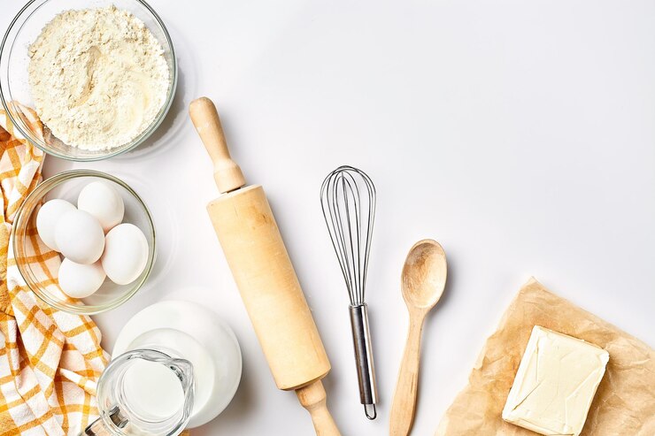 Photo preparation of the dough a measurement of the amount of ingredients in the recipe ingredients for the dough flour eggs rolling pin whisk milk butter cream top view space for text