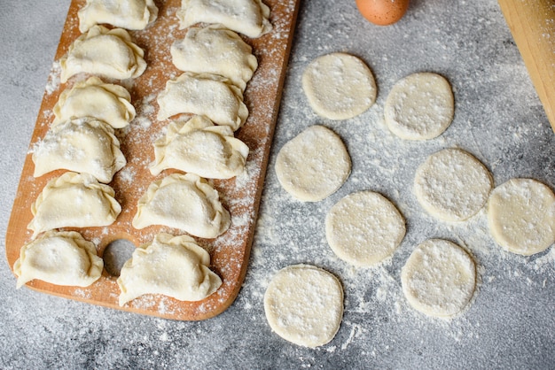 Preparation dough and production of circles from dough for preparation of dumplings with a stuffing. it can be used as a background