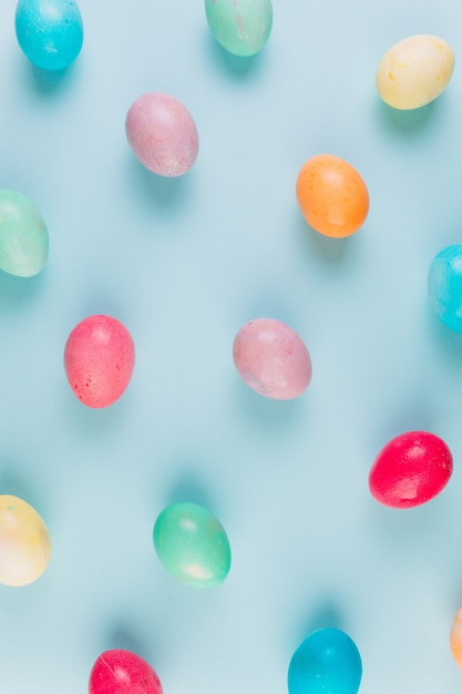 Preparation for Easter. Сolored eggs on a blue background